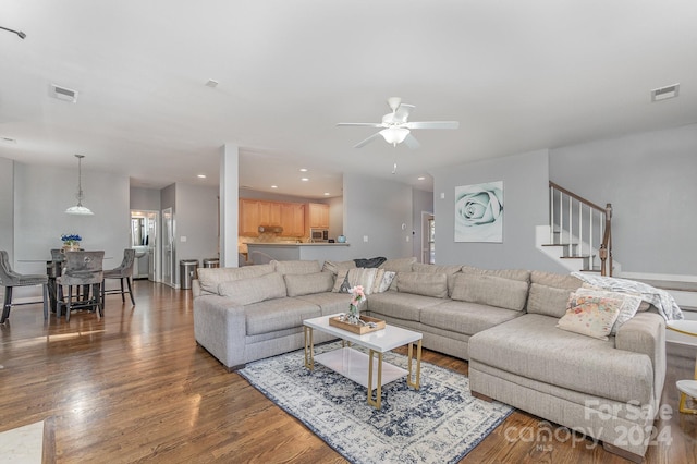 living room with ceiling fan and wood-type flooring