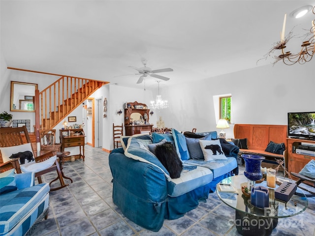 tiled living room with ceiling fan with notable chandelier