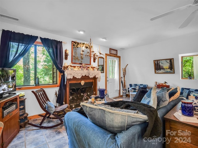 tiled living room featuring ceiling fan