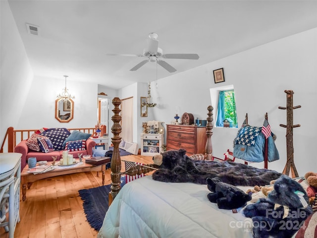 bedroom with ceiling fan and hardwood / wood-style flooring