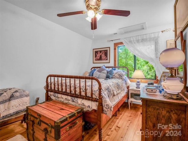 bedroom featuring ceiling fan and light hardwood / wood-style floors