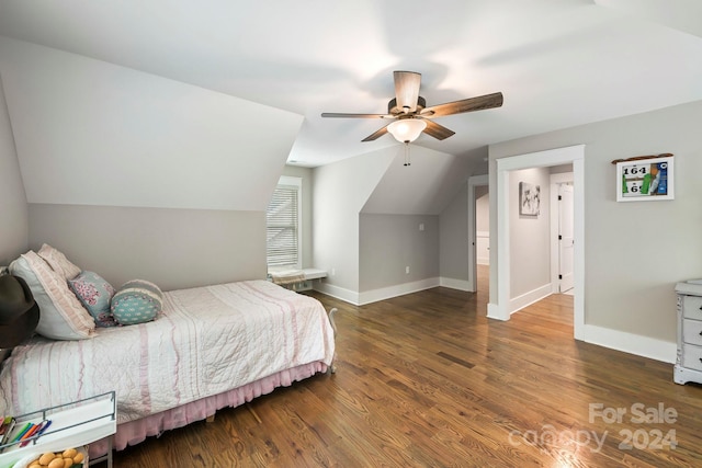 bedroom with lofted ceiling, dark hardwood / wood-style floors, and ceiling fan