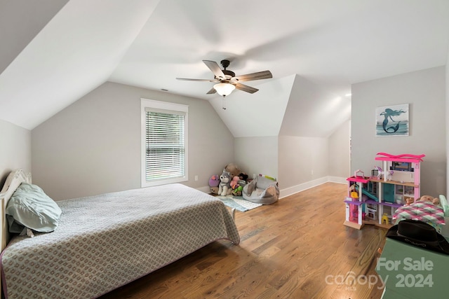 bedroom featuring lofted ceiling, hardwood / wood-style floors, and ceiling fan