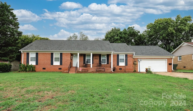 ranch-style house featuring a porch, a garage, and a front lawn