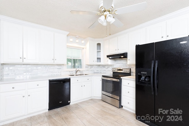 kitchen with sink, black appliances, white cabinets, and backsplash