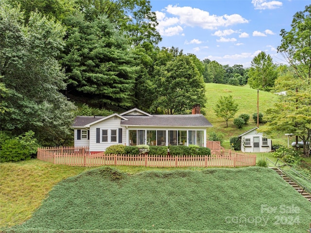 ranch-style home with a front yard