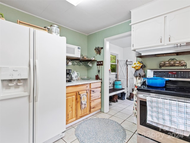 kitchen with white appliances, white cabinets, light countertops, under cabinet range hood, and light tile patterned flooring