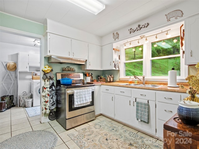 kitchen with under cabinet range hood, a sink, white cabinetry, and stainless steel range with electric cooktop