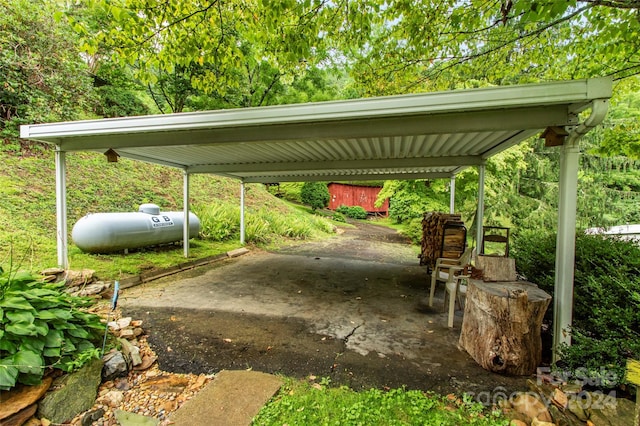 view of parking / parking lot with a detached carport