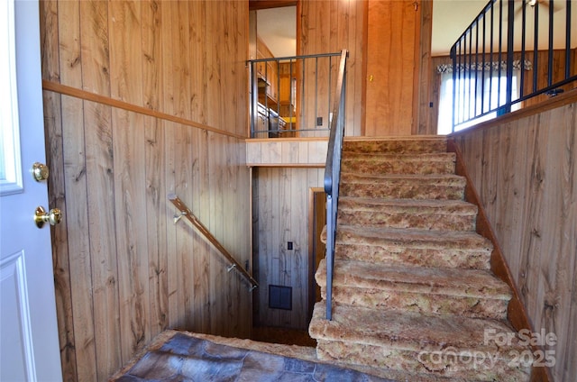 stairway with wooden walls