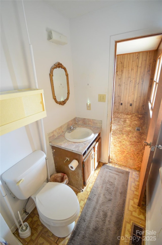 bathroom with vanity and toilet