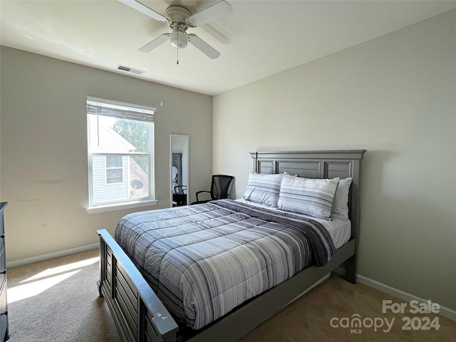 bedroom with a ceiling fan, carpet, visible vents, and baseboards