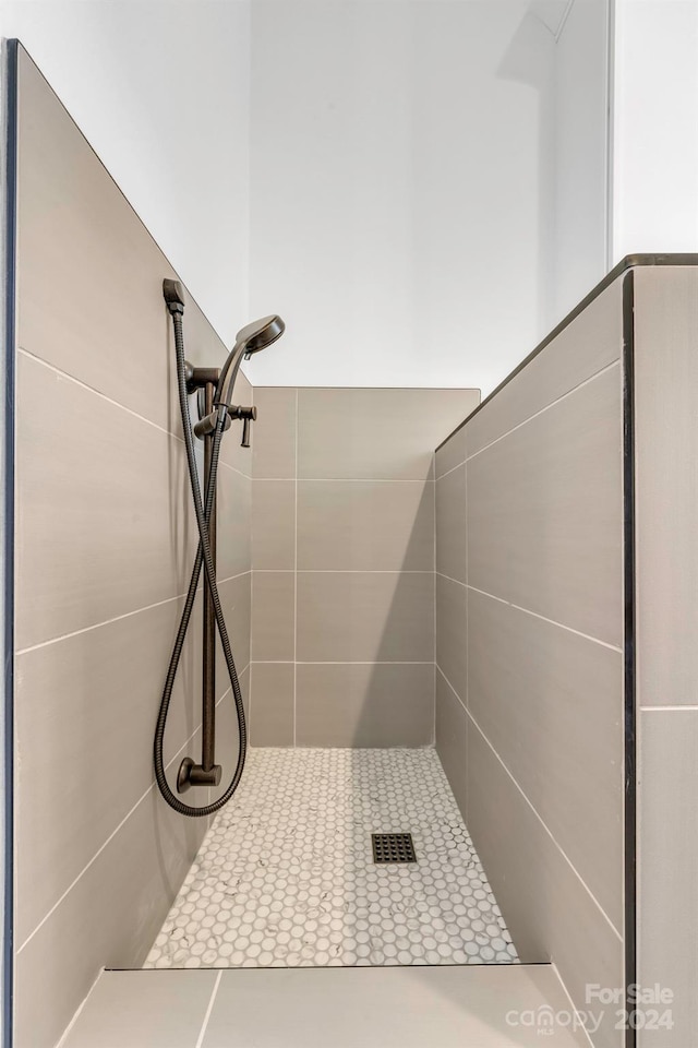 bathroom with a tile shower