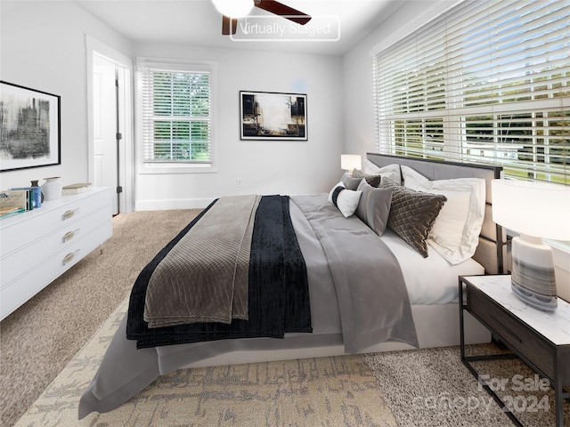 bedroom with ceiling fan and carpet flooring