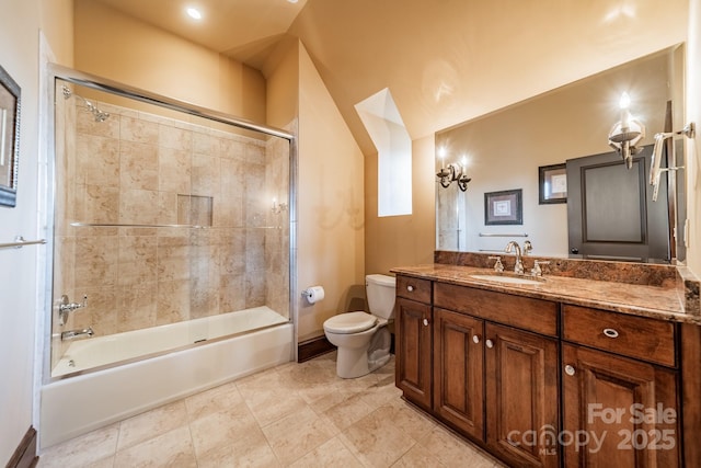 full bathroom with toilet, tiled shower / bath combo, and vanity