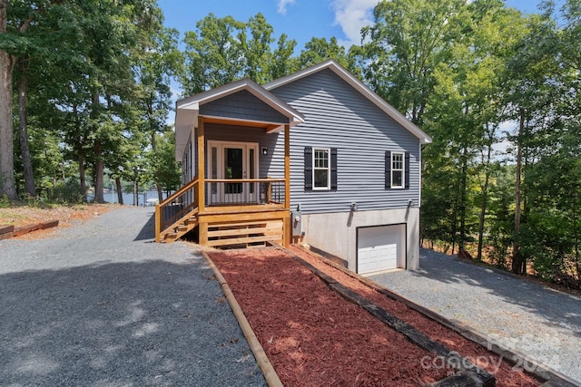 view of front of house with a garage and a porch