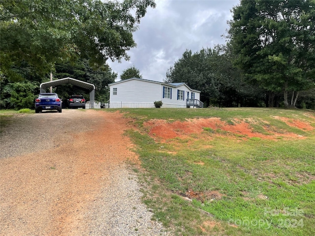 view of property exterior with a carport and a yard