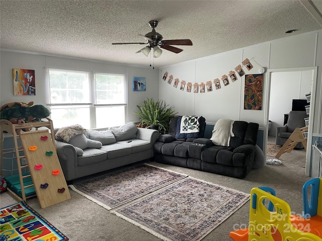 carpeted living room featuring ceiling fan and a textured ceiling