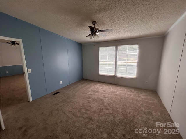 6261 Burnhurst Ln, Denver, NC 28037 - carpeted spare room with ceiling fan and a textured ceiling