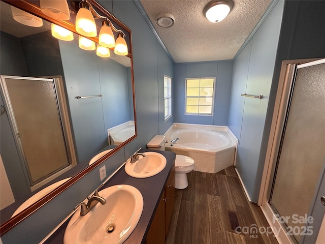 6261 Burnhurst Ln, Denver, NC 28037 - full bath with a textured ceiling, wood finished floors, a shower stall, a bath, and double vanity