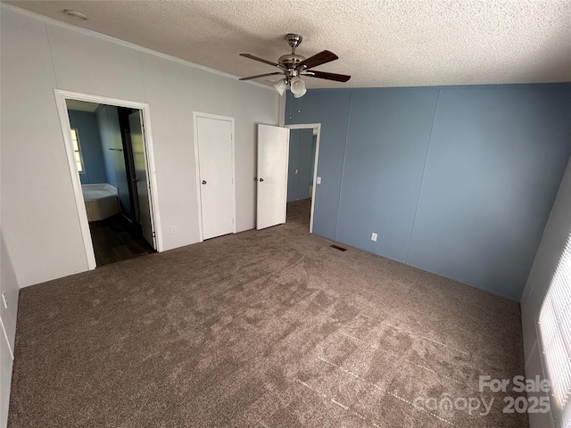 6261 Burnhurst Ln, Denver, NC 28037 - unfurnished bedroom featuring carpet floors, a textured ceiling, ensuite bath, and a ceiling fan