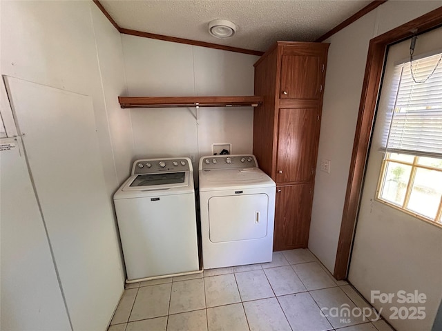 6261 Burnhurst Ln, Denver, NC 28037 - clothes washing area with independent washer and dryer, cabinet space, crown molding, a textured ceiling, and light tile patterned flooring
