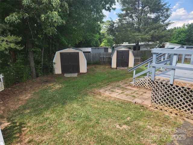 6261 Burnhurst Ln, Denver, NC 28037 - view of yard with a shed, a wooden deck, and an outbuilding