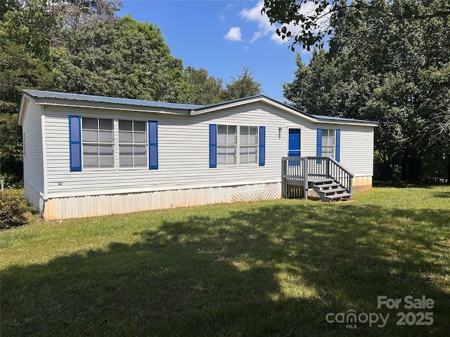 6261 Burnhurst Ln, Denver, NC 28037 - manufactured / mobile home featuring a front lawn