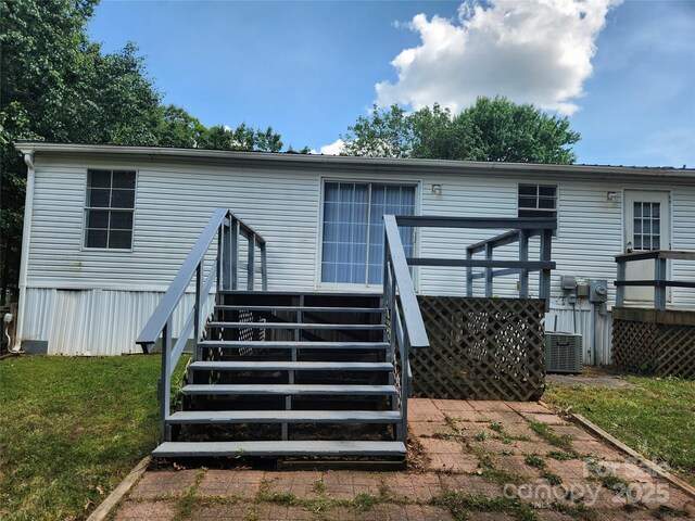 6261 Burnhurst Ln, Denver, NC 28037 - rear view of house with a wooden deck, stairs, cooling unit, and a lawn