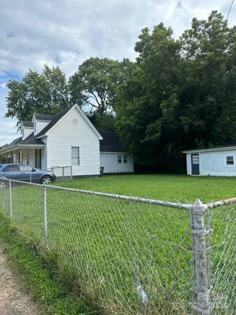 view of property exterior with a lawn