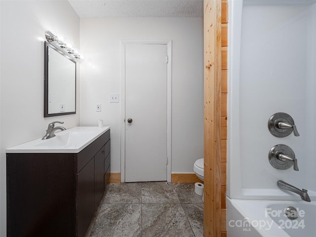 full bathroom featuring tile patterned flooring, a textured ceiling, toilet, vanity, and shower / bathtub combination