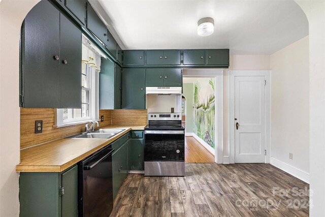 kitchen with electric stove, tasteful backsplash, sink, black dishwasher, and dark hardwood / wood-style floors