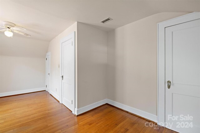 bonus room featuring vaulted ceiling, light wood-type flooring, and ceiling fan