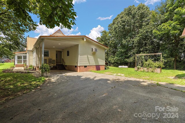 exterior space with a front lawn