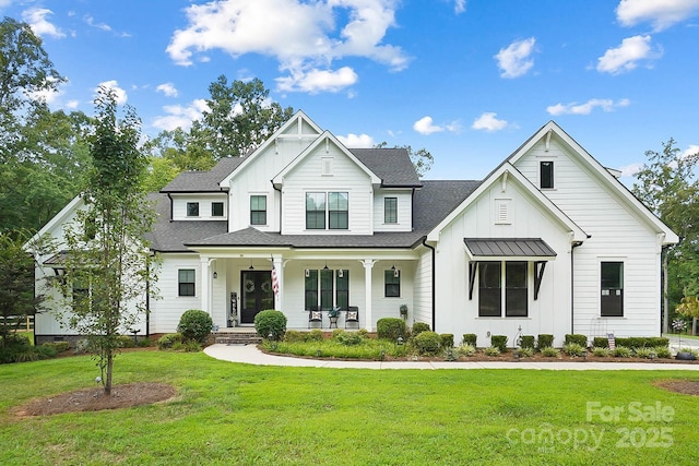 modern farmhouse style home featuring covered porch and a front yard