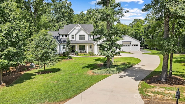 view of front of property with a garage and a front yard