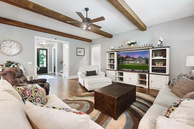 living room with ceiling fan and dark hardwood / wood-style floors