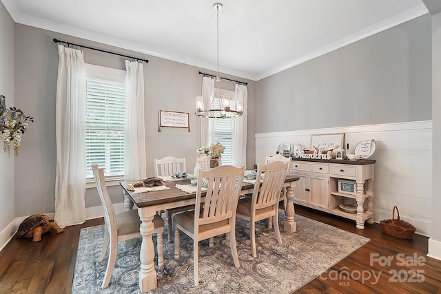 dining space with a wealth of natural light, dark wood-type flooring, and a notable chandelier