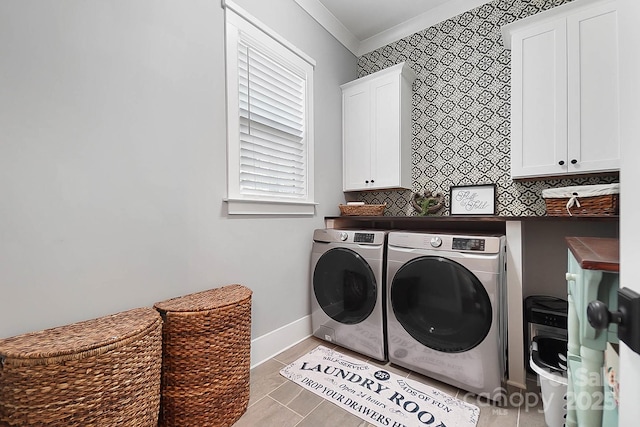 laundry area with cabinets, crown molding, light tile patterned flooring, and washer and dryer