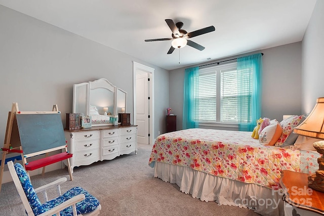 bedroom with ceiling fan and carpet floors