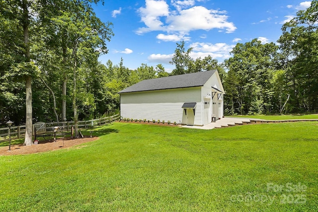 view of outbuilding with a yard