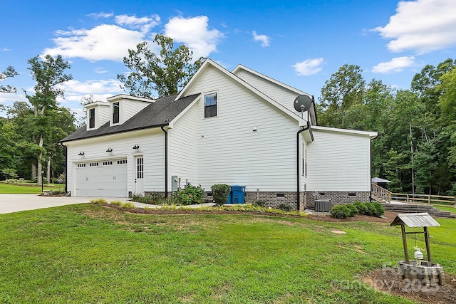 view of property exterior featuring a lawn, a garage, and central air condition unit