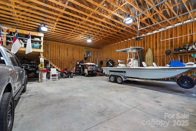 garage featuring wooden walls