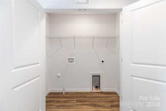 washroom featuring gas dryer hookup, washer hookup, dark wood-type flooring, and electric dryer hookup