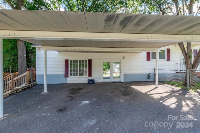 exterior space with a carport