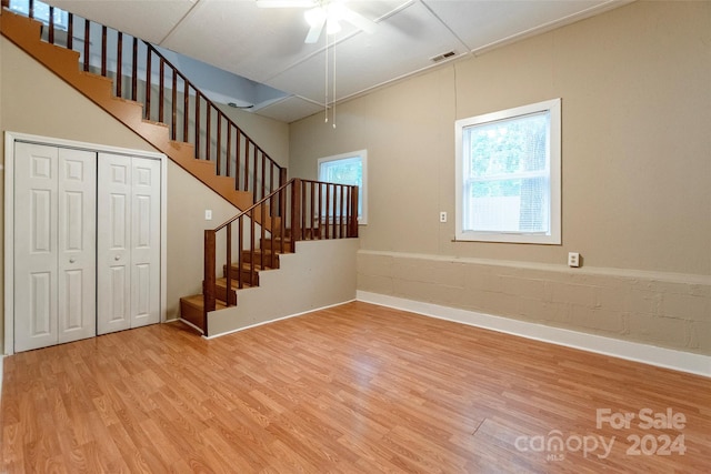 stairs featuring hardwood / wood-style floors