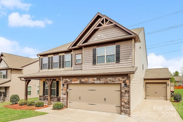 craftsman house featuring a garage and covered porch