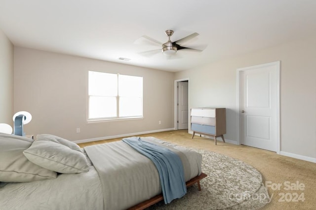 bedroom with ceiling fan and carpet