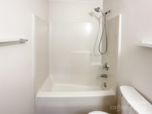 bathroom with toilet and tub / shower combination