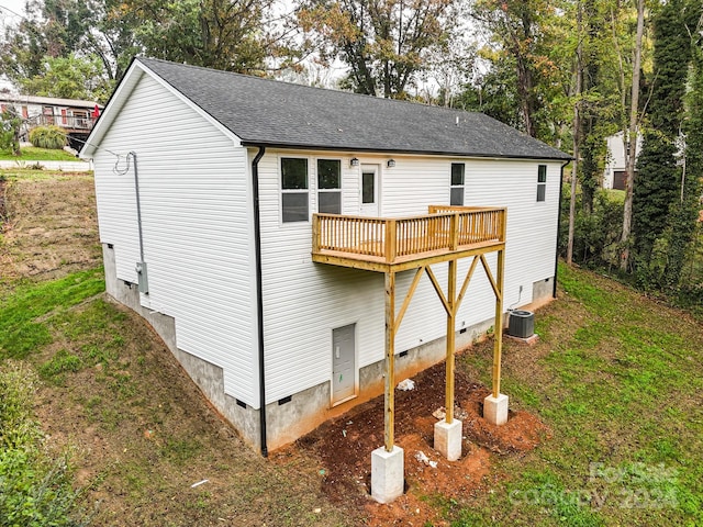 back of house with central AC